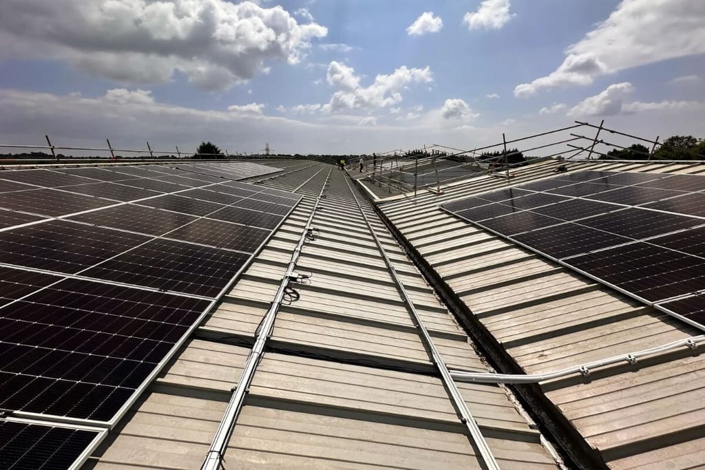 Solar panels installed on a large building roof